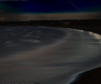 Dark image from a video camera shooting for 10 minutes, shows a beach and where varying degrees of movement happened.